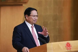 越南政府总理范明政发表讲话。图自越通社