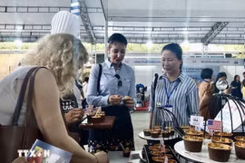 美国向越南消费者推销农产品。图自越通社