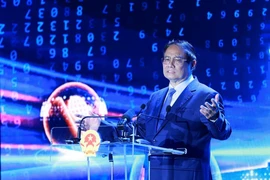 越南政府总理范明政发表讲话。图自越通社