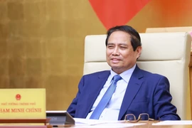 越南政府总理范明政主持会议。图自越通社