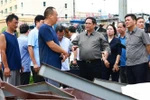 政府总理范明政视察广宁省第3号台风灾后恢复工作。图自越通社