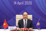 越南政府总理就关于新冠肺炎疫情的东盟领导人特别会议和东盟与中日韩领导人特别会议取得的成果答记者问