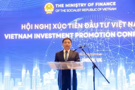 越南财政部长阮文胜发表讲话。图自越通社