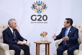 范明政总理会见加拿大总理马克·卡尼。图自越通社