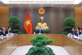 越南政府总理黎明兴与新西兰总理克里斯托弗·拉克森通电话。图自越通社