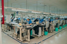 富牌工业区一家日资企业的纺织品服装生产。图自msvhue.com