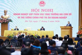 越南政府总理范明政主持关于实现经济两位数增长会议。图自越通社