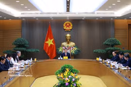 越南政府总理黎明兴在政府总部同弗里德里希·默茨（Friedrich Merz）通电话。图自越通社