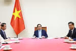 越南政府总理范明政与卡塔尔首相兼外交大臣通电话 。图片来源：越通社