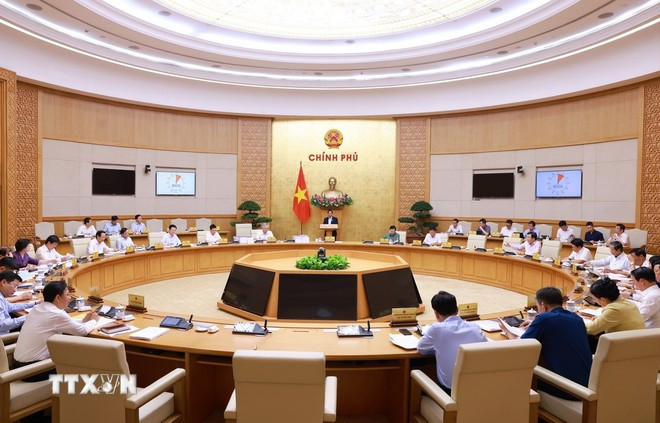 会议场景。图自越通社 thu-tuong-pham-minh-chinh-chu-tri-cuoc-hop-chinh-phu-chuyen-de-ve-viec-sap-xep-don-vi-hanh-chinh-cac-cap-8021748.jpg