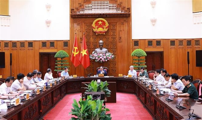 会议场景。图自越通社 vna-potal-thu-tuong-chu-tri-cuoc-hop-thuong-truc-chinh-phu-ve-trung-tam-tai-chinh-quoc-te-8024394.jpg