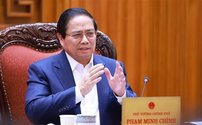 政府总理范明政要求尽早确定实行免费医疗的路线图。图自越通社