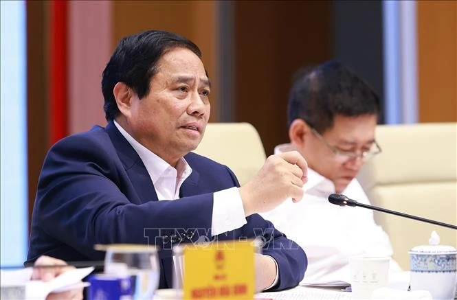 越南总理范明政在会议上发表讲话。图自越通社