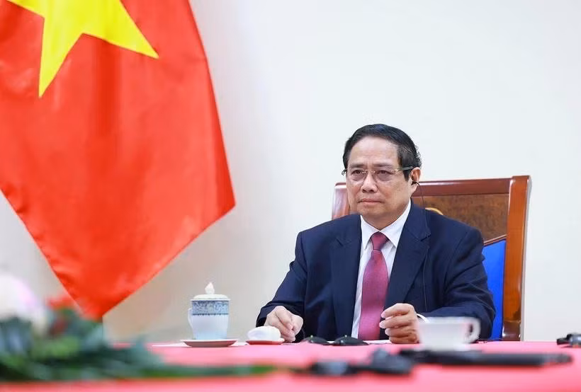 越南政府总理范明政与新西兰总理克里斯托弗·拉克森通电话。图自越通社