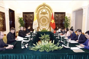 会见场景。图自越通社