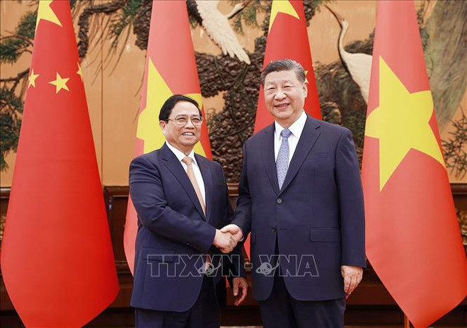 范明政总理会见中共中央总书记、国家主席习近平。图自越通社 thu_tuong_pham_minh_chinh_hoi_kien_tong_bi_thu_chu_tich_trung_quoc_tap_can_binh_stand.jpg