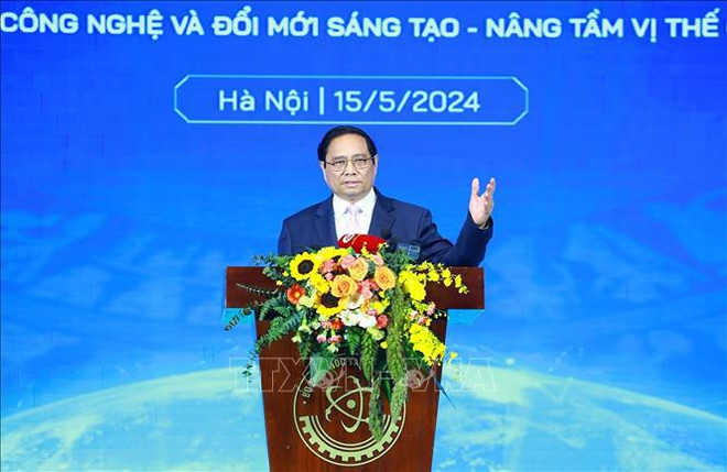 ·15日上午,越南政府总理范明政出席了5·18越南科技日庆祝活动和科技部成立65周年纪念仪式。图自越通社 thu-tuong-150524.jpg