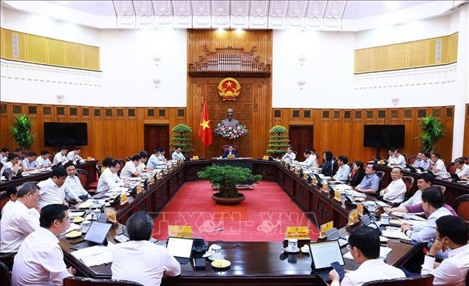 越南政府总理范明政在政府总部主持召开政府常务委员会与各有关部委会议。图自越通社 uuid=BCBB7A3C-DAE1-4DB0-9FC3-03C431D32739&library=1&type=1&mode=1&loc=true&cap=true (1).jpeg