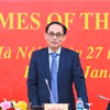 越共中央政治局委员、外交部长黎怀忠在会议上通报越共十四大取得的成果。图自越通社