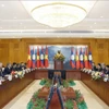 越共中央总书记苏林一行与老挝国会主席赛宋蓬·丰威汉会晤现场。图自越通社