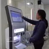 长河乡民众办理行政手续。图自越通社