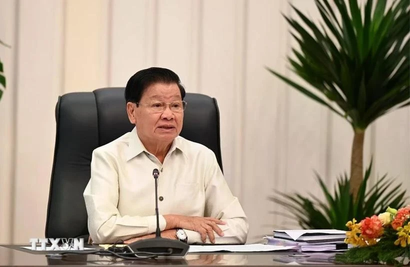 老挝人民革命党中央总书记、国家主席通伦·西苏里在纪念活动上致辞。图自越通社
