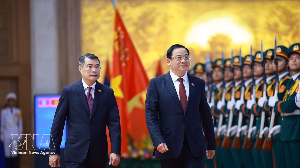 黎明兴总理举行隆重仪式 欢迎老挝总理对越进行正式访问