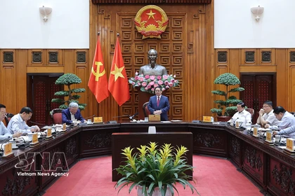 越南政府总理范明政在会议上发表讲话。图自越通社