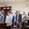 被告人出庭受审（12月18日上午二审庭审）。图自越通社
