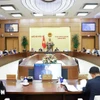 国会常委会召开一场会议。图自越通社