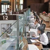 客户在越南外贸股份商业银行（Vietcombank）办理业务。图自越通社
