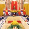 越共中央总书记、国家主席苏林与韩国总统李在明举行会谈。图自越通社