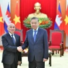 越共中央总书记与柬埔寨国王诺罗敦·西哈莫尼。图自越通社