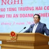 越南政府总理范明政发表讲话。图自越通社