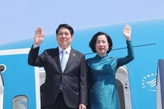 越南国家主席梁强与夫人。图自越通社