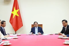 越南政府总理范明政与卡塔尔首相兼外交大臣通电话 。图片来源：越通社