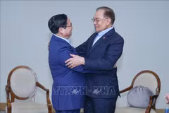 政府总理范明政会见马来西亚总理安瓦尔·易卜拉欣。图自越通社