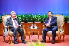 政府总理范明政会见联合国秘书长古特雷斯。图自越通社