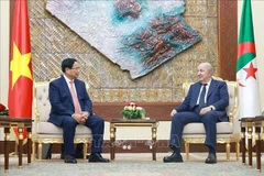 政府总理范明政会见阿尔及利亚总统特本。图自越通社