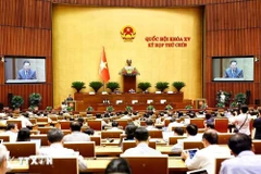 5月24日，听取关于《服刑人员移交法》草案、《引渡法》草案的呈文和审查报告。图自越通社
