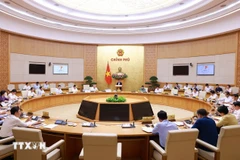 越南政府总理范明政主持召开政府专题会议。图自越通社