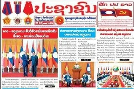 老挝人民革命党中央机关报《人民报》12日头条头版发表有关苏林访老之行的文章。图自越通社