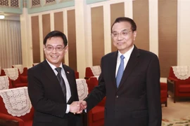 中国与新加坡加强合作 共同维护基于规则的自由贸易