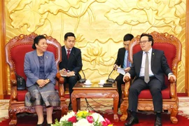 越共中央对外部部长黄平君会见老挝革命人民党中央对外部代表团