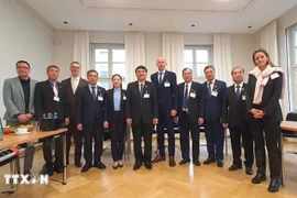 与会代表合影。图自越通社