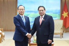 越南政府总理范明政会见离任前来拜会的柬埔寨驻越大使查伊