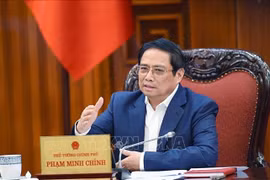 越南政府总理范明政：促进颁布有关债务重组和公司债券的两项通知