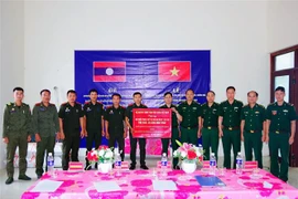 越老两国加强合作 共建和平友谊的边界线