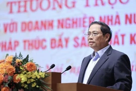 越南政府总理范明政主持政府常务委员会与全国国有企业会议