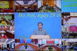 政府总理范明政：新冠肺炎疫情防控工作取得成功展现出越南精神、本领和智慧